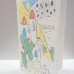 Biglietto di auguri in carta di Amalfi con raffigurazione di uno scorcio della città nello stile della ceramica vietrese.