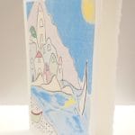 Cartolina pieghevole in carta di Amalfi colore avorio con illustrazione in stile della ceramica vietrese del borgo marinaro della città di Atrani.
