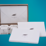 Box with single elegant wedding invitations and Amalfi paper envelopes