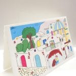Cartolina in carta a mano di Amalfi colore avorio con illustrazione di un classico borgo della costiera amalfitana
