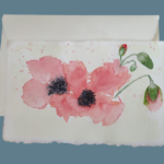 Amalfi paper wedding invitations with an illustration of a poppy made in watercolor by Lo Scrigno di S. Chiara