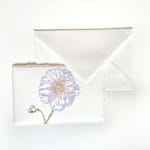 Amalfi handmade paper wedding place card decorated with an engraved lilac Mallow.